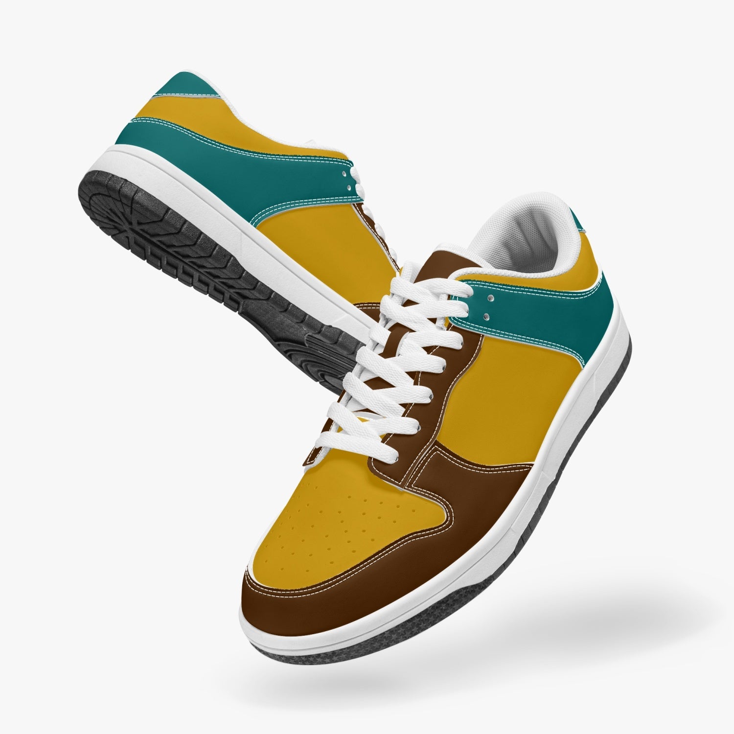 Unique retro color inspired low top leather sneakers. Crafted with premium leather, these sneakers feature teal, yellow and brown color ways for a playful look. Versatile and durable. Shop now for a bold fashion statement!