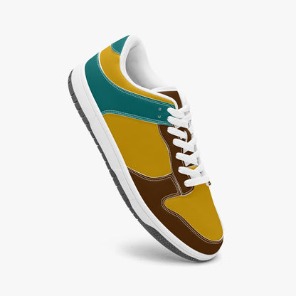 Unique retro color inspired low top leather sneakers. Crafted with premium leather, these sneakers feature teal, yellow and brown color ways for a playful look. Versatile and durable. Shop now for a bold fashion statement!